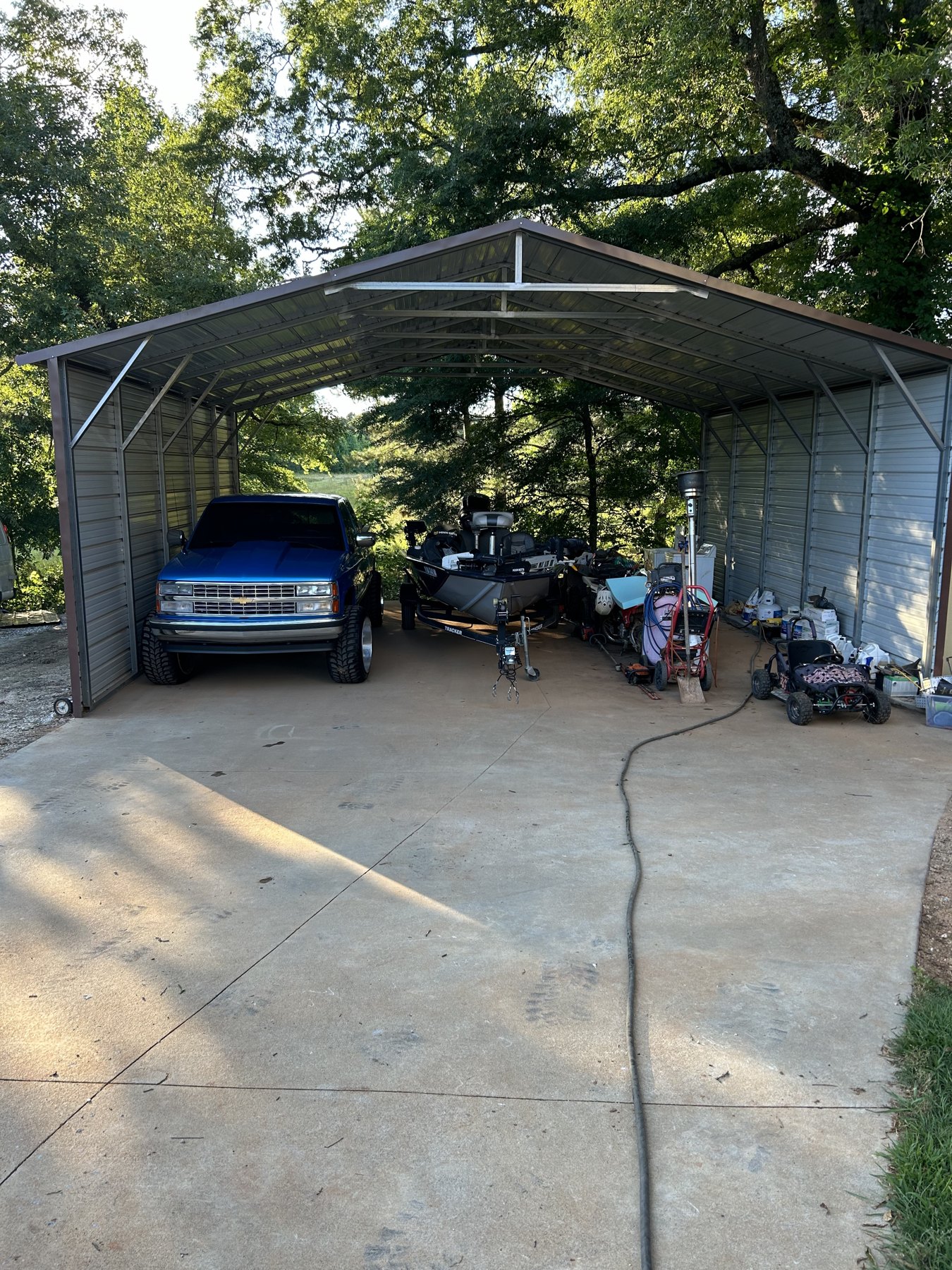 Large backyard slab after photo 5 showing finished driveway and pad concrete work by Colquitt Concrete in Georgia