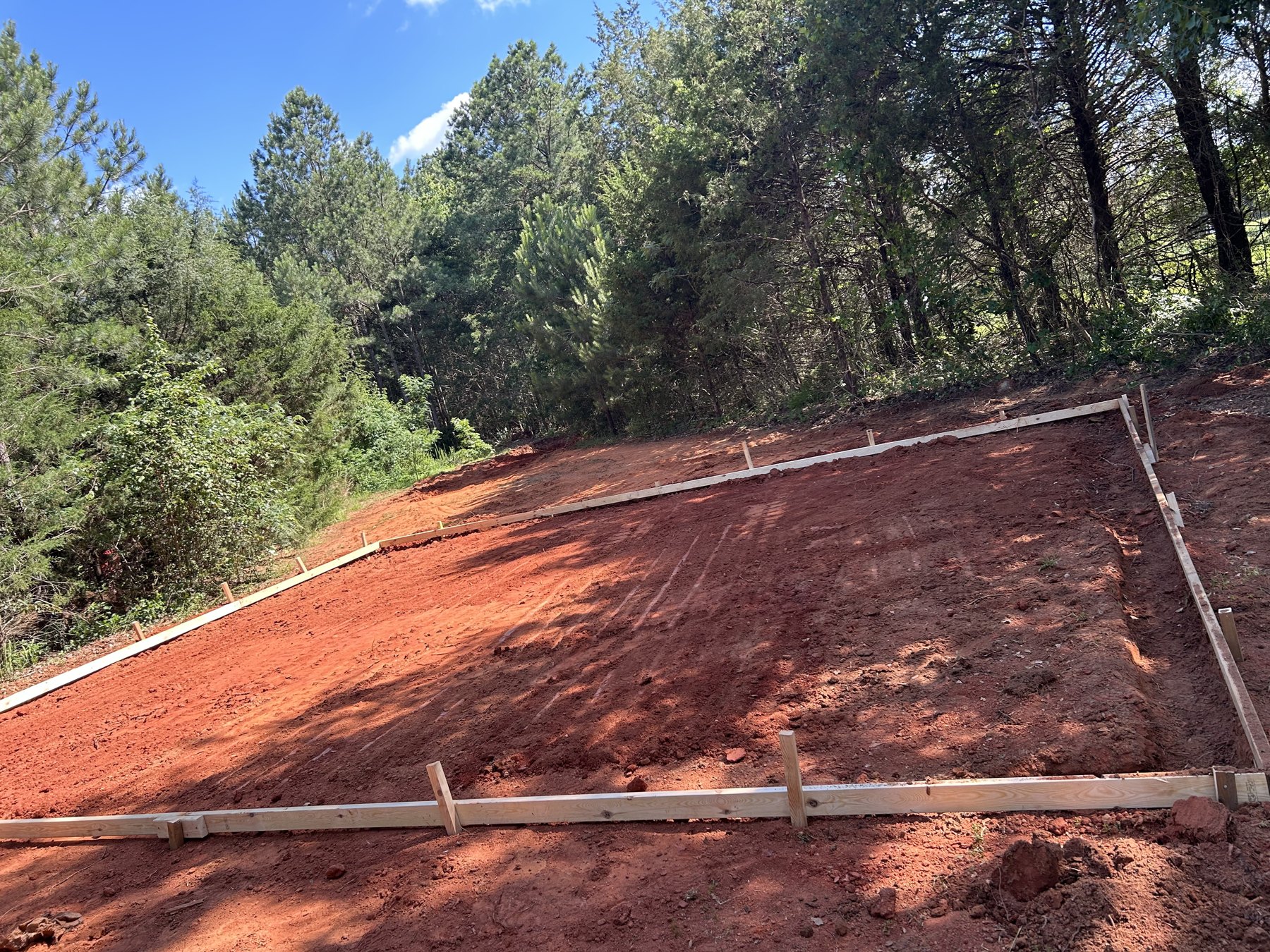 Large backyard slab before photo 4 showing driveway and pad concrete preparation by Colquitt Concrete in Georgia