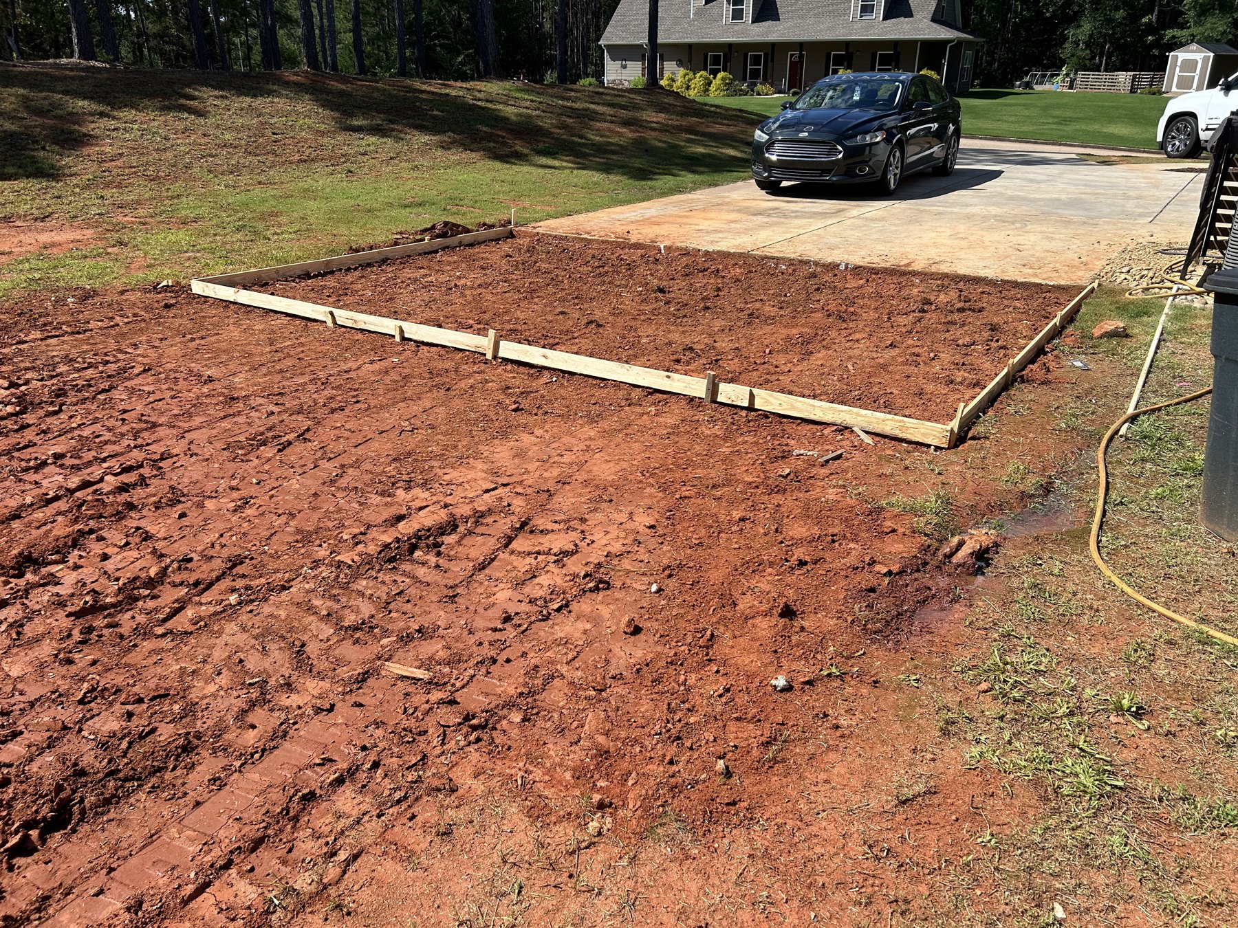 Large backyard slab before photo 5 showing driveway and pad concrete preparation by Colquitt Concrete in Georgia