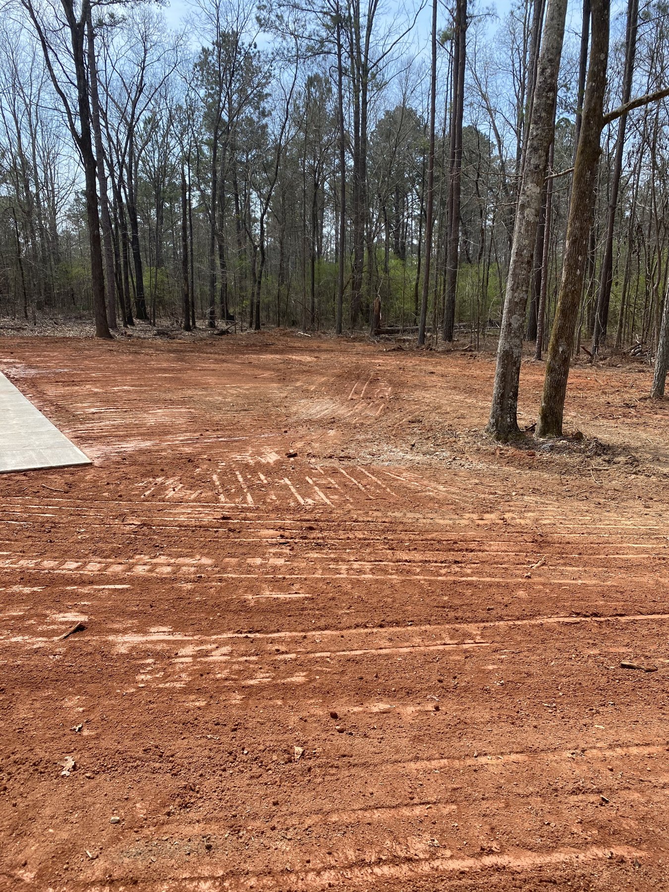 Large residential drive before photo 1 showing driveway concrete preparation by Colquitt Concrete in Georgia