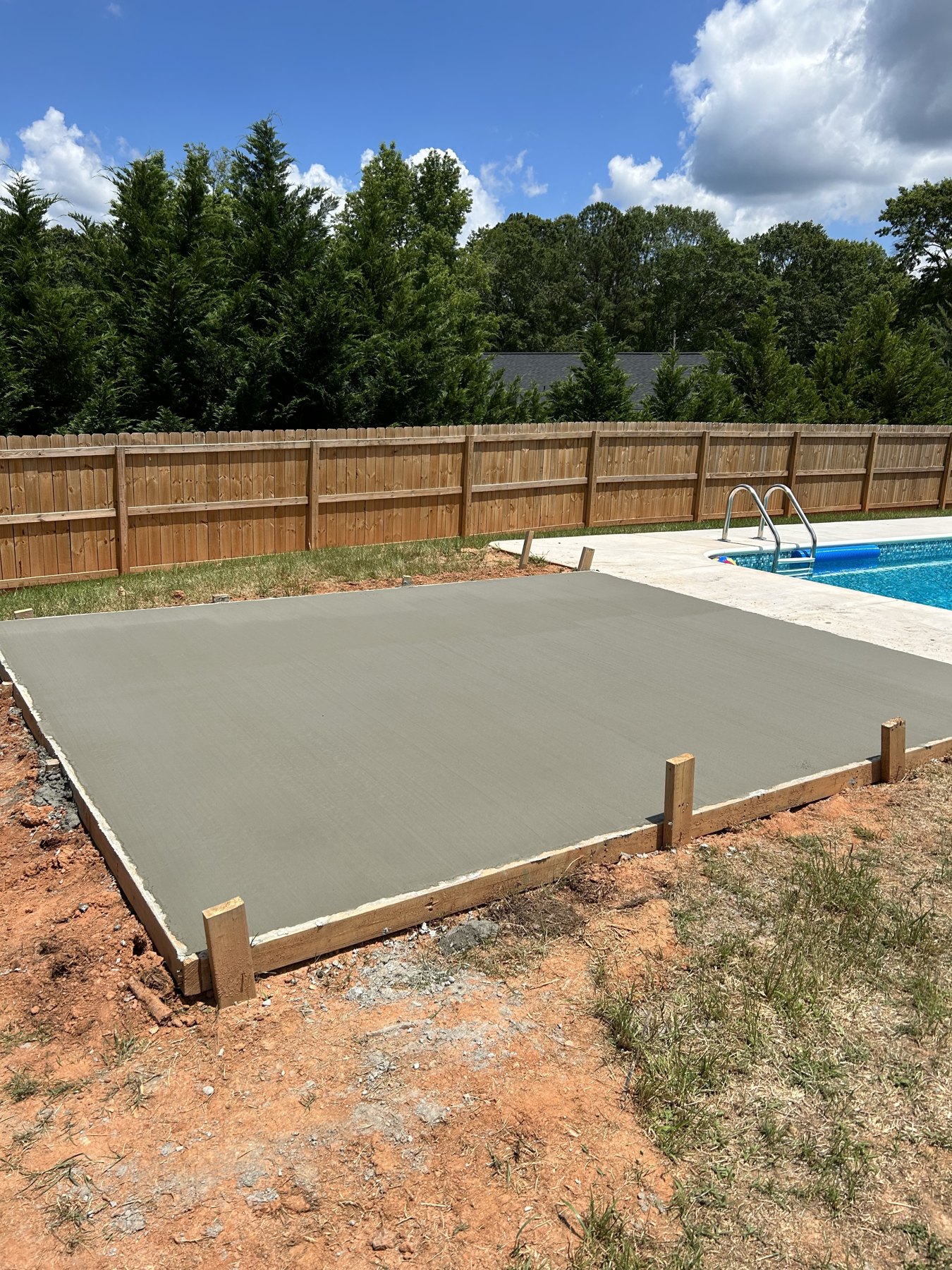 Pool deck extension after photo 1 showing finished pool deck concrete work by Colquitt Concrete in Georgia