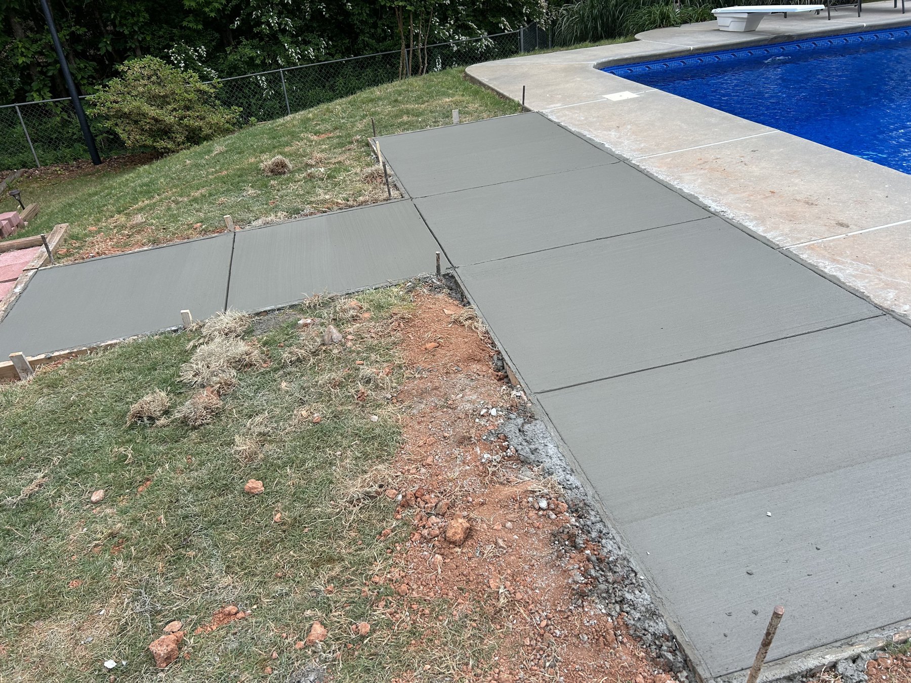 Pool deck extension after photo 3 showing finished pool deck concrete work by Colquitt Concrete in Georgia