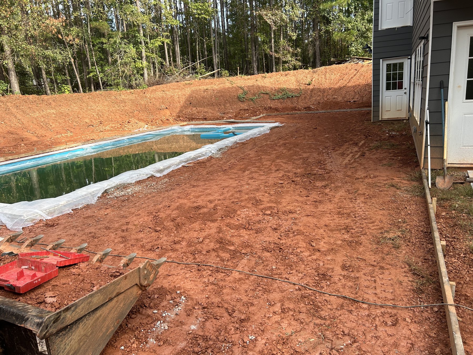 Pool deck extension before photo 3 showing pool deck concrete preparation by Colquitt Concrete in Georgia