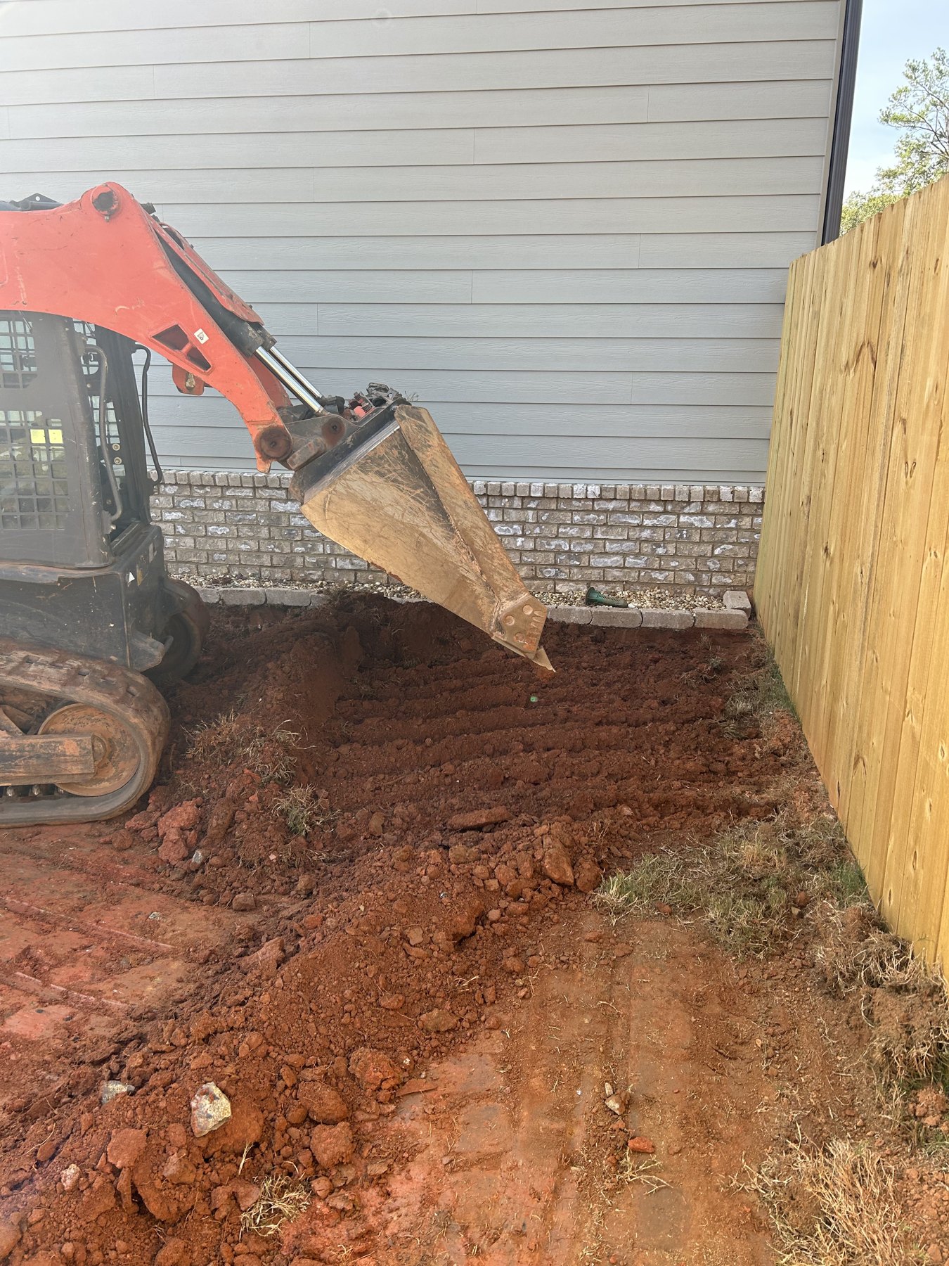 Side driveway extension before photo 2 showing driveway concrete preparation by Colquitt Concrete in Georgia