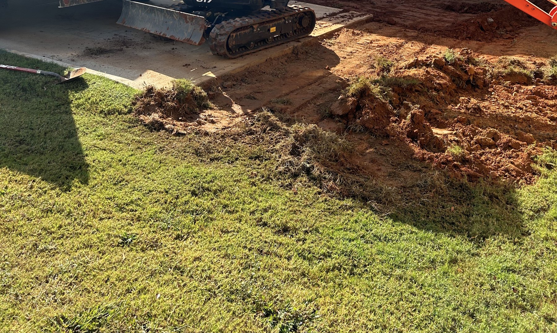 Side driveway extension before photo 5 showing driveway concrete preparation by Colquitt Concrete in Georgia